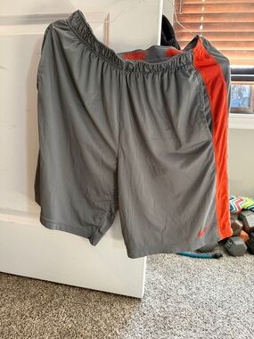 Nike Men’s Gray Athletic Shorts with Orange Side Panels